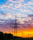 Silhouettes high voltage electric pylon in sunset background Royalty Free Stock Photo