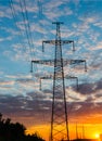 Silhouettes high voltage electric pylon in sunset background Royalty Free Stock Photo