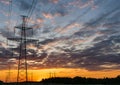 Silhouettes high voltage electric pylon in sunset background Royalty Free Stock Photo