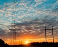 Silhouettes high voltage electric pylon in sunset background Royalty Free Stock Photo