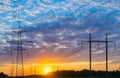 Silhouettes high voltage electric pylon in sunset background Royalty Free Stock Photo