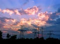 Silhouettes high voltage electric pylon in sunset background Royalty Free Stock Photo