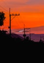 Silhouettes of high voltage power lines Royalty Free Stock Photo