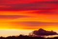 Silhouettes of hills under a cloudy sky during a beautiful sunset in Patagonia, Argentina Royalty Free Stock Photo