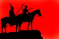 Silhouettes of a horse and riders