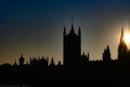 Silhouettes Of The Houses Of Parliament With Victoria Tower And Sun Beams Behind Westminster Abbey, City Of London, United Kingdom
