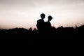 Silhouettes of kids hiking at sunset Royalty Free Stock Photo