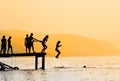 Silhouettes of kids jumping Royalty Free Stock Photo