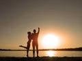 Silhouettes of a loving couple on the beach. Sunset on the beach Royalty Free Stock Photo