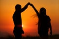 Silhouettes of a loving couple at sunset . the concept of love and romance.