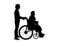 Silhouettes of man walking grandmother in wheelchair Royalty Free Stock Photo