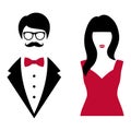 A man in a black suit with a bow tie and a woman in a red dress Royalty Free Stock Photo