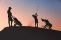 Man with his son golfers silhouette Royalty Free Stock Photo