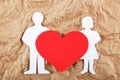 Silhouettes of men, women and heart cut out of paper. Royalty Free Stock Photo