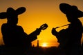 Silhouettes of a mexican musicians mariachi Royalty Free Stock Photo