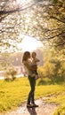 Silhouettes of mom and baby in the shade of trees Royalty Free Stock Photo