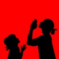 Silhouettes of mother and child with praying hands.