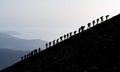 Mountaineers hiking uphill Royalty Free Stock Photo