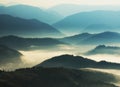 Silhouettes of mountains. A misty autumn morning. Dawn in the Carpathians Royalty Free Stock Photo