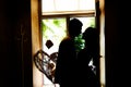 Silhouettes of the newlyweds in the cafe