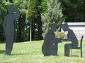 Silhouettes of One Soldier Comforting Female Soldier and Buglar Blowing Bugle