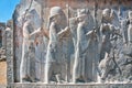 Silhouettes of people in ancient costumes on the destroyed stone bas-relief Royalty Free Stock Photo