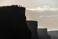 Silhouettes of people on the Cliffs of Moher, Ireland