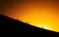 Silhouettes of people climbing Royalty Free Stock Photo