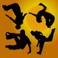 Silhouettes of people doing parkour