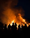 Silhouettes of people in frontof big fire Royalty Free Stock Photo
