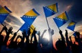 Silhouettes of People Holding Flag of Bosnia and H