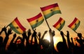 Silhouettes of People Holding Flag of Ghana Royalty Free Stock Photo