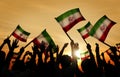 Silhouettes of People Holding Flag of Iran Royalty Free Stock Photo