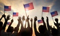 Silhouettes of People Holding the Flag of USA Royalty Free Stock Photo