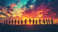 Silhouettes of people holding hands at sunset Royalty Free Stock Photo