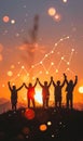 Silhouettes of people holding hands at sunset, symbolizing unity, teamwork, and collaboration. A glowing line graph Royalty Free Stock Photo