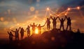 Silhouettes of people holding hands at sunset, symbolizing unity, teamwork, and collaboration. A glowing line graph Royalty Free Stock Photo