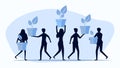 Silhouettes of people holding trees. The concept of a customer who conserves nature. people planting trees together