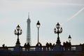 Silhouettes of people and lanterns on the famous Alexandre III bridge and the Eiffel tower Royalty Free Stock Photo