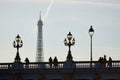 Silhouettes of people and lanterns on the famous Alexandre III bridge and the Eiffel tower Royalty Free Stock Photo