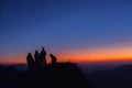 silhouettes of people on mountains Group of friends victory together having see wive sunrise and mountains backdrop