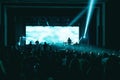 Silhouettes of people and musicians in big concert stage