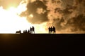 People silhouettes at sunset. Royalty Free Stock Photo