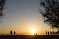 People on the beach, watching the sunset Royalty Free Stock Photo