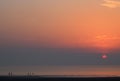 Silhouettes people and sunset over Morecambe Bay Royalty Free Stock Photo