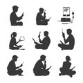 Silhouettes of People Using Electronic Devices: A Collection of Modern Technology Users Royalty Free Stock Photo