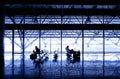 Silhouettes of people waiting at the boarding gates. Royalty Free Stock Photo