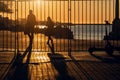 Silhouettes of people walking against the sun in embankment in sunset. Sevastopol, Crimea