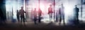 Silhouettes of people walking in the street near skyscrapers and modern office buildings. Multiple exposure blurred image. Royalty Free Stock Photo