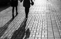 Silhouettes of people walking the streets of a big city Royalty Free Stock Photo